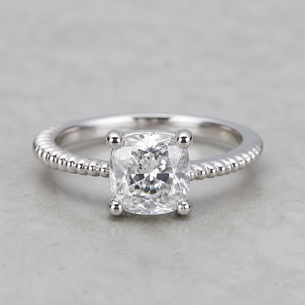 A women's ring. cushion cut single diamant on partly bead bright setting band in White gold
photorealistic jewelry design, A women's ring. cushion cut single diamant on partly bead bright setting band in White gold, modern style, just the design no text