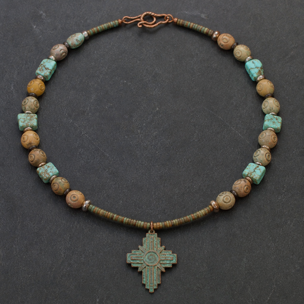 "8.5-9mm soapstone in earth tones with carved eye round beads, turquoise chunky chips 9x12mm, Heishi beads 3mm, copper with green patina cross pendant 3x4" necklace "
photorealistic jewelry design, "8.5-9mm soapstone in earth tones with carved eye round beads, turquoise chunky chips 9x12mm, Heishi beads 3mm, copper with green patina cross pendant 3x4" necklace ", art_deco style, just the design no text