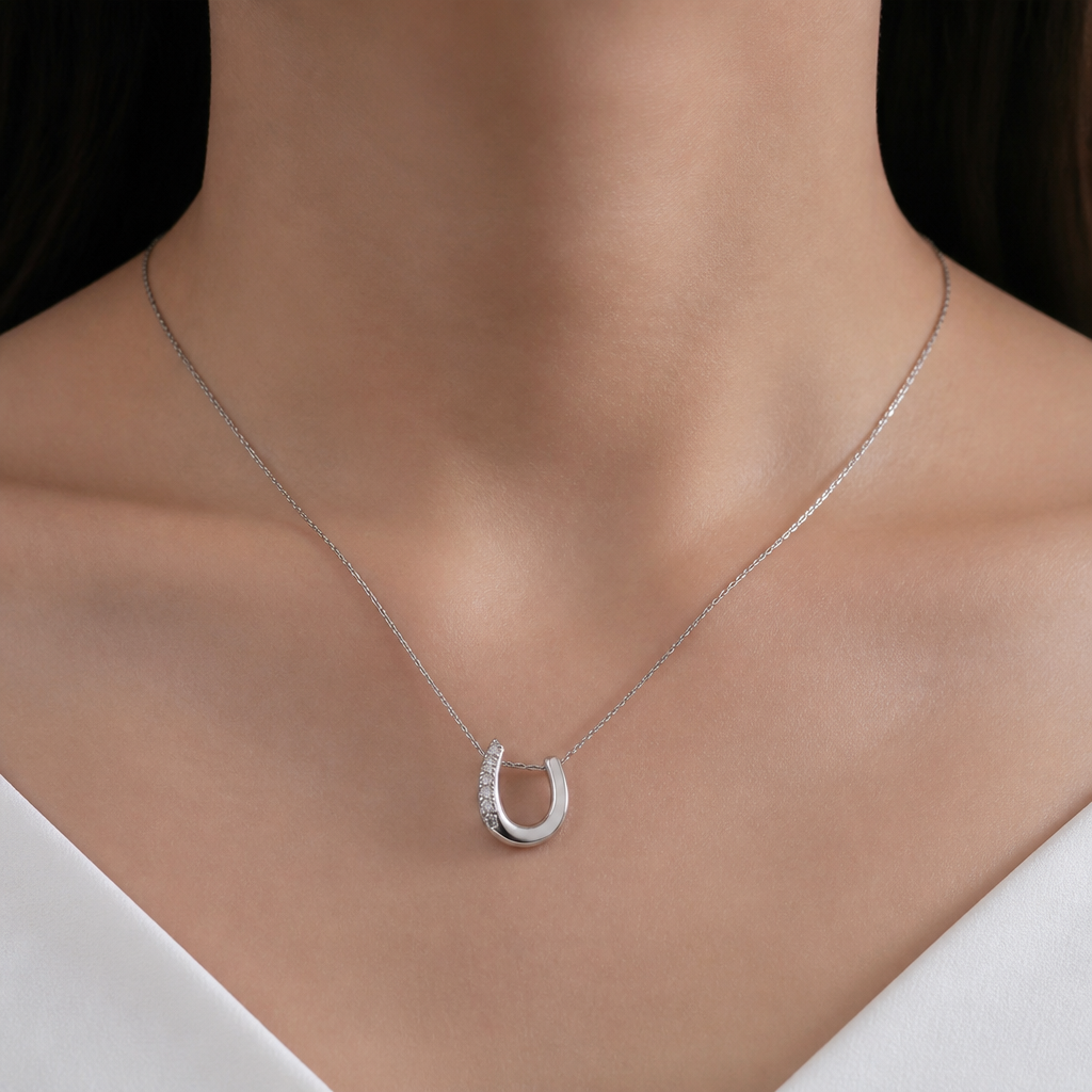 A modern women's necklace made of silver suitable for daily wear
photorealistic jewelry design, A modern women's necklace made of silver suitable for daily wear, modern style, just the design no text