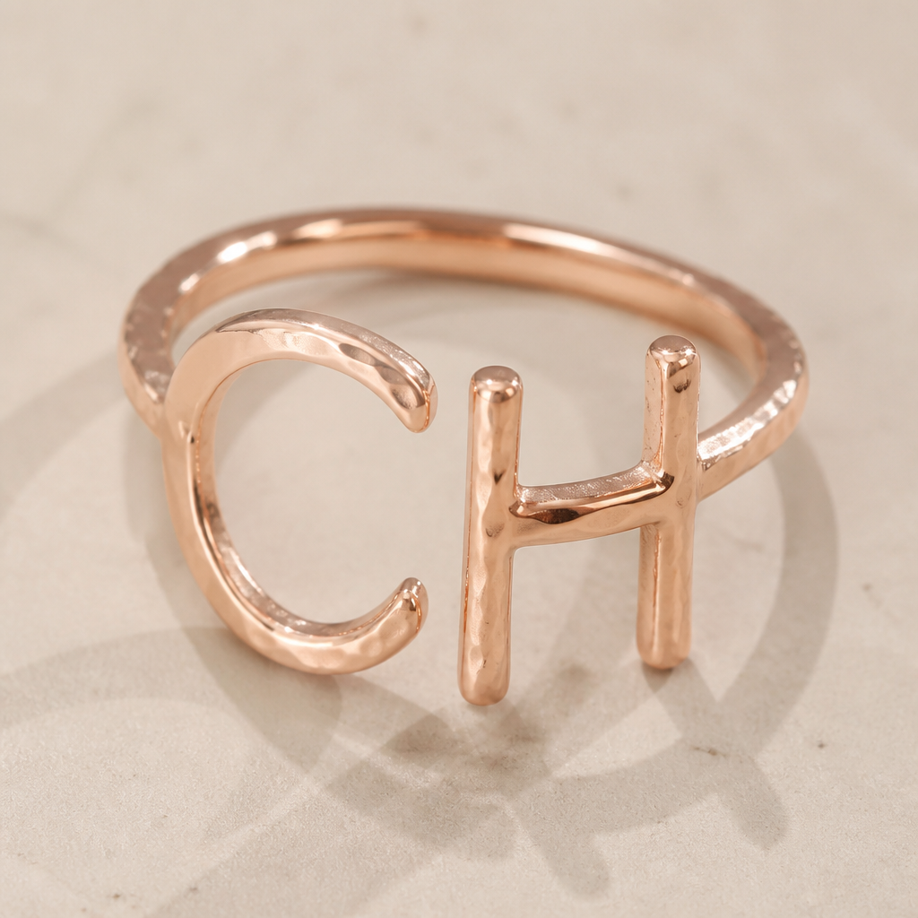 A women's ring made of gold. anillo rustico con letra inicial CH en oro rosa