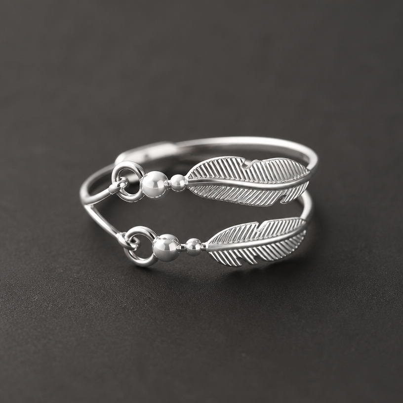 A women's ring made of silver
using the attached image as a visual reference, create A women's ring made of silver. photorealistic, just the design no text