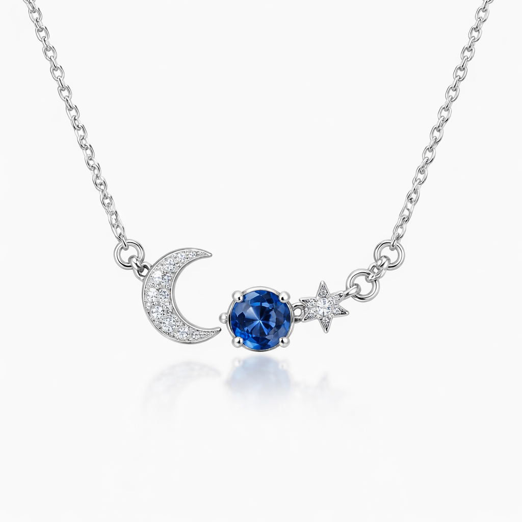 A minimalist women's necklace made of silver with diamond and sapphire stones suitable for daily wear. colar com elementos do céu noturno