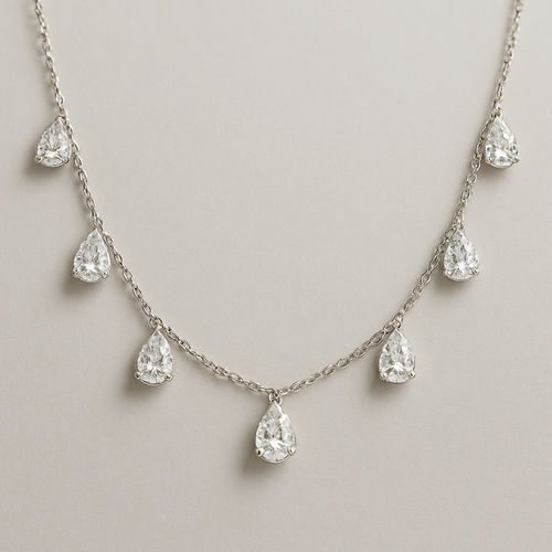 Pear shape pears station necklace 7 diamonds each diamonds .15 no bezel