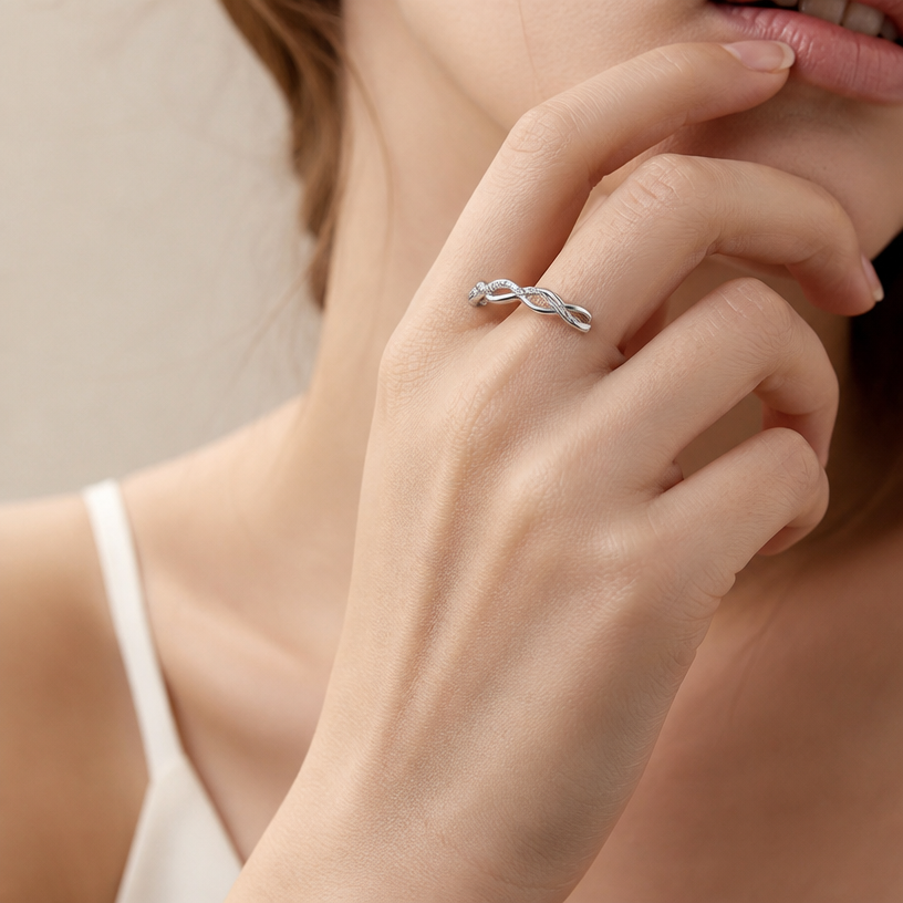 Jewelry photoshoot (worn)
Show the jewelry piece from the image worn by an elegant model in a professional editorial photograph, soft studio lighting. Reproduce the jewelry's exact design, metal, stones and details faithfully. Photorealistic, no text. Additional instructions: "Close-up beauty/editorial photo of a woman's wrist and hand, fair light skin tone, gently relaxed pose (resting on a soft surface or lightly touching her face/collarbone). Soft, warm neutral studio background (beige/cream tones), softly blurred, shallow depth of field.
She wears a delicate sterling silver chain bracelet featuring a small round bezel-set cubic zirconia stone on one side of the chain and a small sideways cross charm on the other side, connected by a fine cable chain.
METAL FINISH: the sterling silver must be rhodium-plated — bright, cool-white, and reflective with a polished mirror-like shine, not dull or matte. The metal should catch light naturally and sparkle realistically, without looking overly glossy, plastic, or artificially glowing.
SKIN REALISM REQUIREMENT: skin must look completely natural and photorealistic — fair, light skin tone to enhance the contrast and shine of the silver, with visible fine skin texture, natural pores, subtle imperfections. Avoid any smooth, plastic, airbrushed, CGI, or overly retouched look. Lighting soft and warm, casting natural gentle shadows.
STRICT SIZE REQUIREMENT: the bracelet must stay true to real-life scale, fine and delicate — the round stone approximately 0.6cm, the cross charm small and slim, both proportionate to the wrist. Do not enlarge or oversize.
BRACELET POSITION: the chain drapes naturally around the wrist, with the round stone and cross charm both visible and facing forward, sitting flat against the skin.
Close-up beauty/editorial photo of a woman's wrist and hand, fair light skin tone, gently relaxed pose (resting on a soft surface or lightly touching her face/collarbone). Soft, warm neutral studio background (beige/cream tones), softly blurred, shallow depth of field.
She wears a delicate sterling silver double-chain bracelet featuring a small infinity symbol charm, partially lined with sparkling pavé cubic zirconia stones on one side, connected by two fine parallel cable chains.
METAL FINISH: the sterling silver must be rhodium-plated — bright, cool-white, and reflective with a polished mirror-like shine, not dull or matte. The metal should catch light naturally and sparkle realistically, without looking overly glossy, plastic, or artificially glowing.
SKIN REALISM REQUIREMENT: skin must look completely natural and photorealistic — fair, light skin tone to enhance the contrast and shine of the silver, with visible fine skin texture, natural pores, subtle imperfections. Avoid any smooth, plastic, airbrushed, CGI, or overly retouched look. Lighting soft and warm, casting natural gentle shadows.
STRICT SIZE REQUIREMENT: the bracelet must stay true to real-life scale, fine and delicate — the infinity charm small and slim, proportionate to the wrist, double chain thin and dainty. Do not enlarge or oversize.
BRACELET POSITION: the double chain drapes naturally around the wrist, with the infinity charm centered and facing forward, sitting flat against the skin.
"Close-up beauty/editorial photo of a woman's wrist and hand, fair light skin tone, gently relaxed pose (resting on a soft surface or lightly touching her face/collarbone). Soft, warm neutral studio background (beige/cream tones), softly blurred, shallow depth of field.
She wears a delicate sterling silver chain bracelet featuring four small round bezel-set cubic zirconia stones evenly spaced along a fine cable chain.
METAL FINISH: the sterling silver must be rhodium-plated — bright, cool-white, and reflective with a polished mirror-like shine, not dull or matte. The metal should catch light naturally and sparkle realistically, without looking overly glossy, plastic, or artificially glowing.
SKIN REALISM REQUIREMENT: skin must look completely natural and photorealistic — fair, light skin tone to enhance the contrast and shine of the silver, with visible fine skin texture, natural pores, subtle imperfections. Avoid any smooth, plastic, airbrushed, CGI, or overly retouched look. Lighting soft and warm, casting natural gentle shadows.
STRICT SIZE REQUIREMENT: the bracelet must stay true to real-life scale, fine and delicate — each round stone approximately 0.5cm, evenly spaced along the thin chain, proportionate to the wrist. Do not enlarge or oversize.
BRACELET POSITION: the chain drapes naturally around the wrist, with all four stones visible and evenly spaced, sitting flat against the skin, catching soft light.
Close-up beauty/editorial photo of a woman's wrist and hand, fair light skin tone, gently relaxed pose (resting on a soft surface or lightly touching her face/collarbone). Soft, warm neutral studio background (beige/cream tones), softly blurred, shallow depth of field.
She wears a delicate sterling silver chain bracelet featuring four small plain polished cross charms dangling evenly along a fine cable chain.
METAL FINISH: the sterling silver must be rhodium-plated — bright, cool-white, and reflective with a polished mirror-like shine, not dull or matte. The metal should catch light naturally and sparkle realistically, without looking overly glossy, plastic, or artificially glowing.
SKIN REALISM REQUIREMENT: skin must look completely natural and photorealistic — fair, light skin tone to enhance the contrast and shine of the silver, with visible fine skin texture, natural pores, subtle imperfections. Avoid any smooth, plastic, airbrushed, CGI, or overly retouched look. Lighting soft and warm, casting natural gentle shadows.
STRICT SIZE REQUIREMENT: the bracelet must stay true to real-life scale, fine and delicate — each cross charm approximately 0.7cm height x 0.5cm width, dangling evenly along the thin chain, proportionate to the wrist. Do not enlarge or oversize.
BRACELET POSITION: the chain drapes naturally around the wrist, with all four cross charms visible and gently dangling, sitting naturally against the skin, catching soft light.
"Close-up beauty/editorial photo of a woman's hand gently resting near her face and jawline, fingers relaxed and slightly curled, showing the finger clearly. Soft, warm neutral studio background (beige/cream tones), softly blurred, shallow depth of field.
She wears a sterling silver twisted infinity open cuff ring, featuring an interwoven double-band design where one smooth polished band crosses over a second band fully lined with sparkling pavé cubic zirconia stones, forming a twisted braid-like pattern.
METAL FINISH: the sterling silver must be rhodium-plated — bright, cool-white, and reflective with a polished mirror-like shine, not dull or matte. The metal should catch light naturally and sparkle realistically, without looking overly glossy, plastic, or artificially glowing.
SKIN REALISM REQUIREMENT: skin must look completely natural and photorealistic — visible fine skin texture, natural pores, subtle imperfections, soft even tone, natural nails. Avoid any smooth, plastic, airbrushed, CGI, or overly retouched look. Lighting soft and warm, casting natural gentle shadows.
STRICT SIZE REQUIREMENT: the ring must stay true to real-life scale, delicate and slim, not bulky or oversized — the twisted pavé band proportionate to the finger.
RING POSITION: the ring sits naturally centered on the finger, open twisted band facing forward and clearly visible, catching soft light along the pavé stones.
Mood: elegant, minimal, intimate — high-end jewelry brand photography style, sharp focus on the ring while keeping the composition natural and soft..