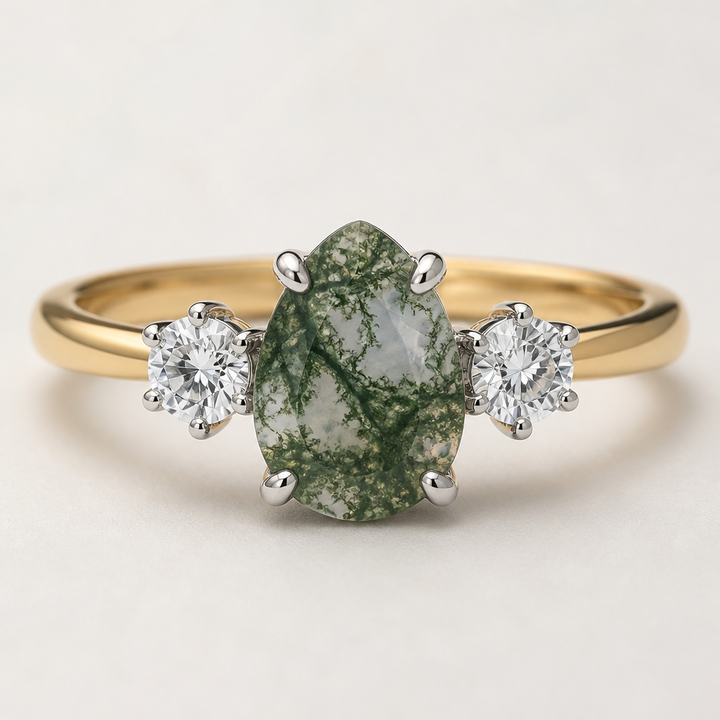 Trilogy ring
10x7mm pear shape moss Agate in 4 x white gold claws
Two x 5mm Round diamonds in 6 x white gold claws
Band of the ring is yellow gold
photorealistic jewelry design, just the design, no text, Trilogy ring with a yellow gold band. A 10x7mm pear shape moss Agate in four white gold claws is flanked by two 5mm Round diamonds, each in six white gold claws.
