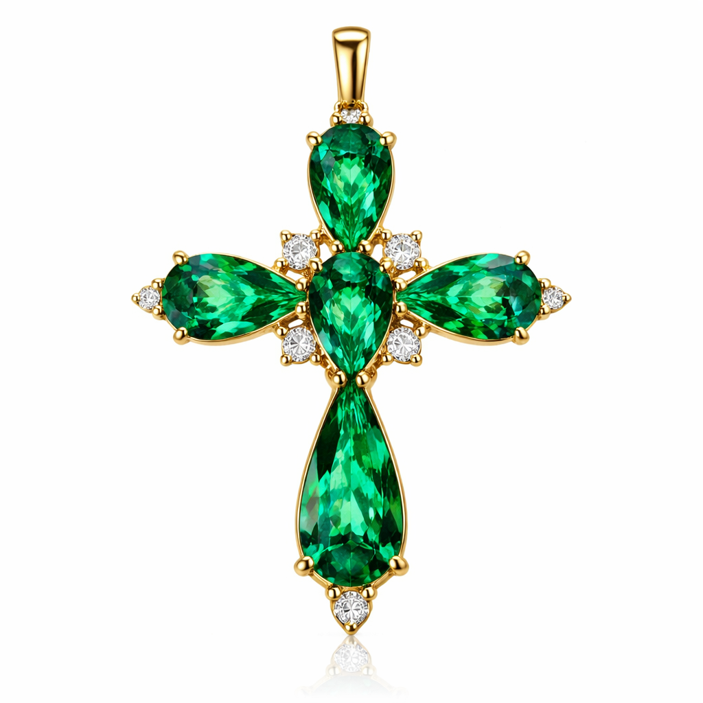 Pear cut Emerald Cross in yellow gold. Classic and stunning. A few accent diamonds.