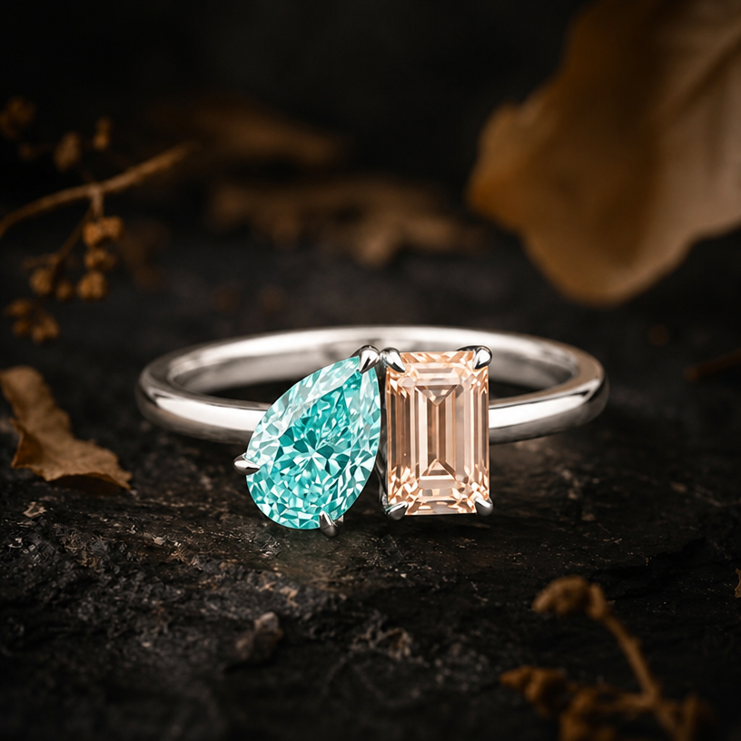 A minimalist women's ring made of silver suitable for wedding. with Paraiba colour pear stone and parapadsha rectangular stone all in radiant cut
using the attached image as a visual reference, create A minimalist women's ring made of silver suitable for wedding. with Paraiba colour pear stone and parapadsha rectangular stone all in radiant cut. photorealistic, just the design no text