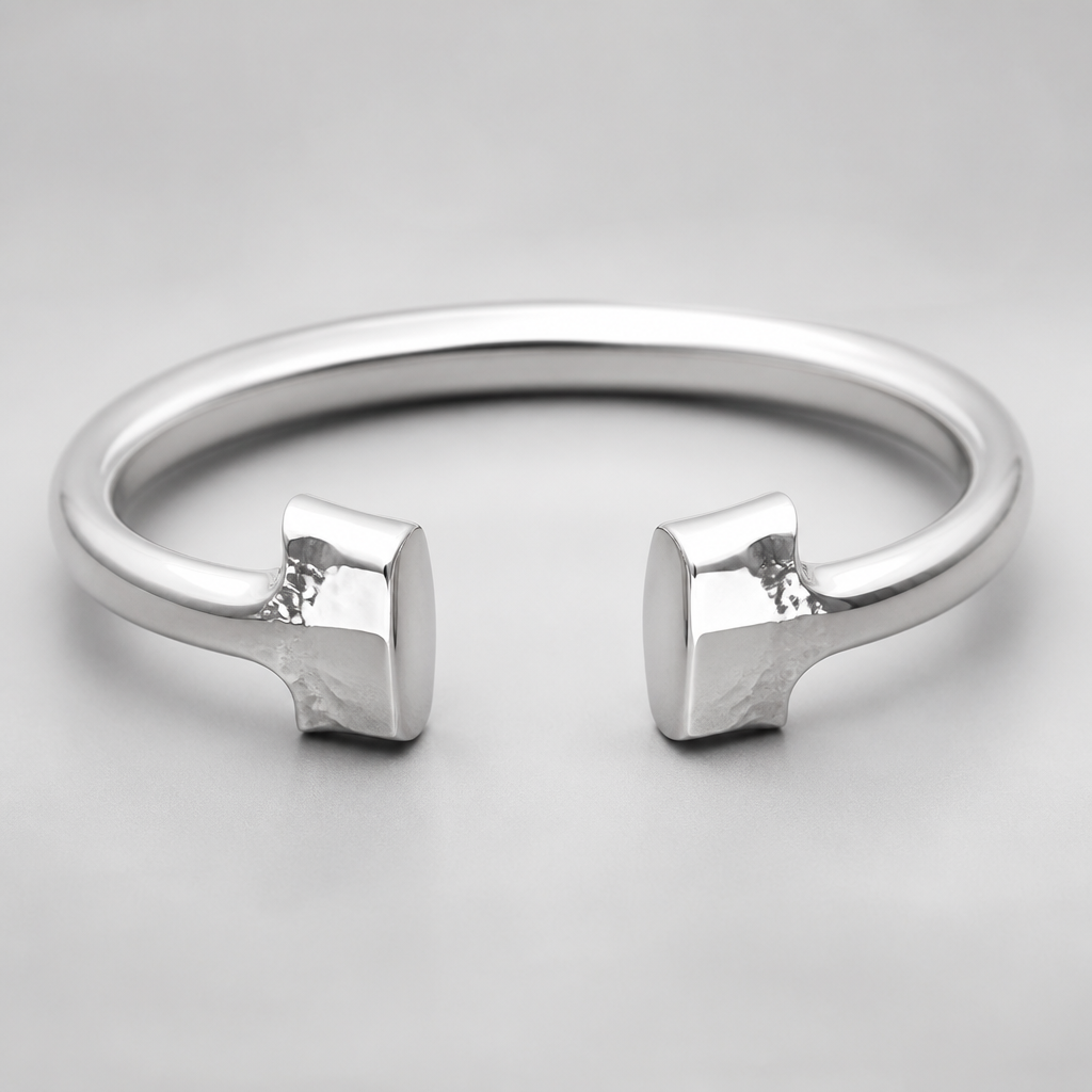 A women's bracelet made of silver. a cuff that looks like a hammer from both ends
photorealistic jewelry design, A women's bracelet made of silver. a cuff that looks like a hammer from both ends, modern style, just the design no text