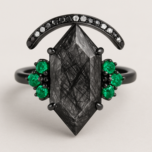 Black band, long kite cut rutilated black quartz, emerald accent stones 3 on each side in a cluster, add a wedding band that curves around the top of the main stone with black and white stones
