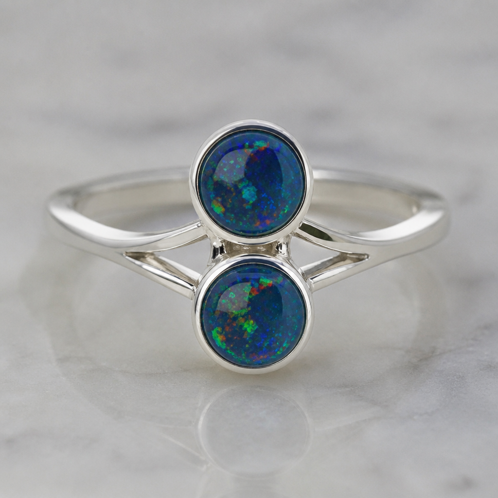 A modern women's ring made of silver suitable for daily wear, minimalist, simple and delicate, clean lines. I want two black opals about 8mm one on top of the other and a simple design on the side
photorealistic jewelry design, A modern women's ring made of silver suitable for daily wear, minimalist, simple and delicate, clean lines. I want two black opals about 8mm one on top of the other and a simple design on the side, modern style, just the design no text