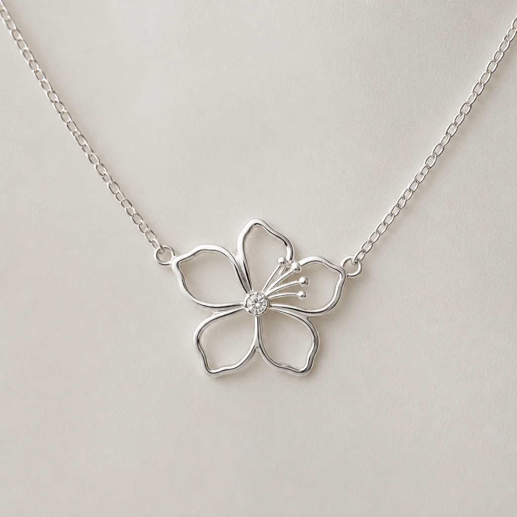 A women's necklace made of silver. hibicus vu de coté ligne fine et delicat ,diamand dans le milieu, interieur de la fleur vide, plus detail, 5 petales chaine de chaque coté, exotique style qui fait pensé à hawaî
photorealistic jewelry design, A women's necklace made of silver. hibicus vu de coté ligne fine et delicat ,diamand dans le milieu, interieur de la fleur vide, plus detail, 5 petales chaine de chaque coté, exotique style qui fait pensé à hawaî, modern style, just the design no text