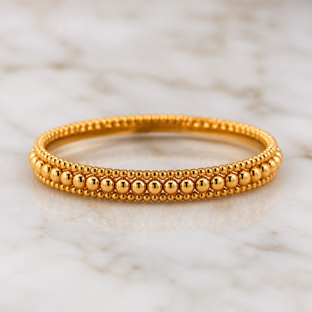A women's ring made of gold. 1mm golden beads and 0mm golden beads single thushi design