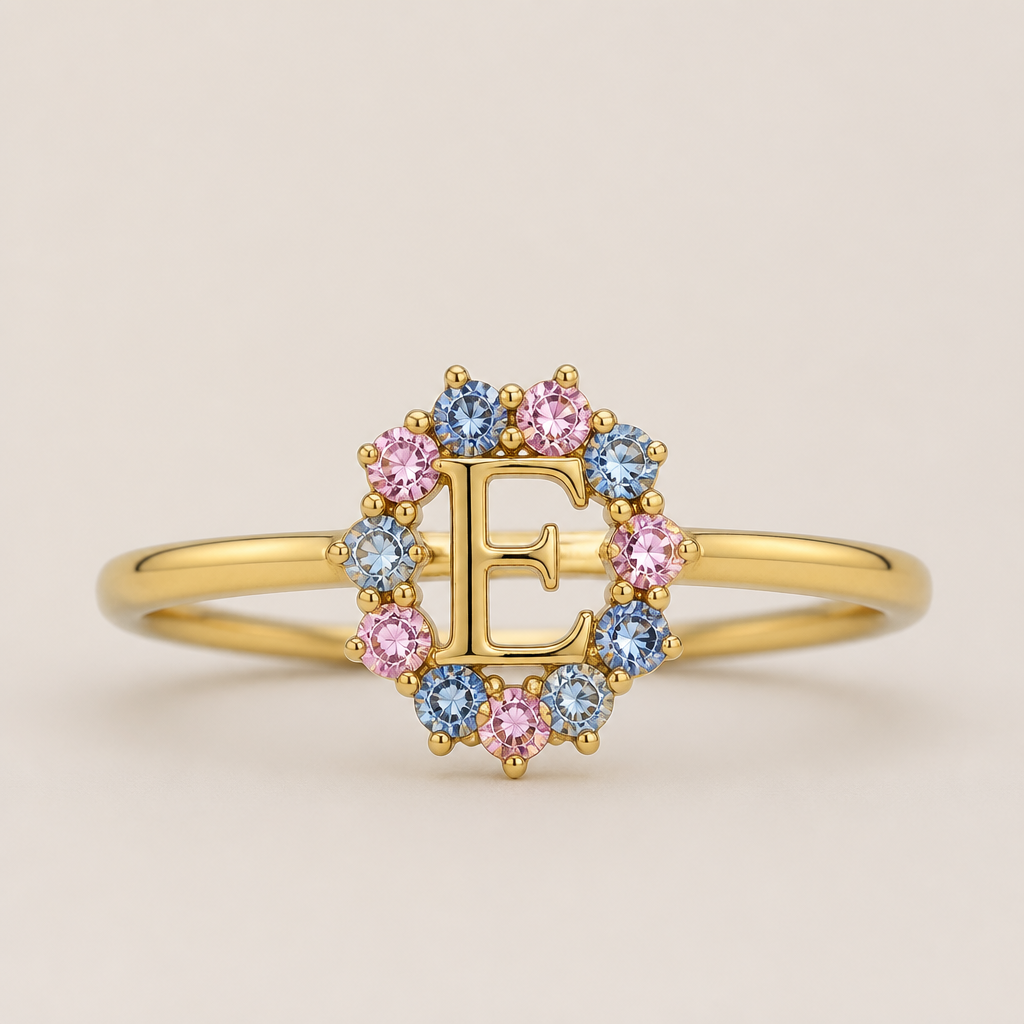A classic women's ring made of gold, minimalist, simple and delicate, clean lines. um anel de 15 anos com inicial E com pedrinhas azul e pedrinhas rosa em volta
photorealistic jewelry design, A classic women's ring made of gold, minimalist, simple and delicate, clean lines. um anel de 15 anos com inicial E com pedrinhas azul e pedrinhas rosa em volta, classic style, just the design no text
