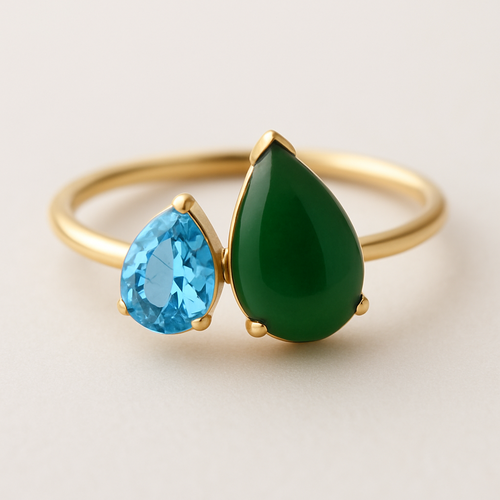 Toi et Moi Ring with a small pear shaped blue topaz and a slightly larger pear shaped nephrite jade stone