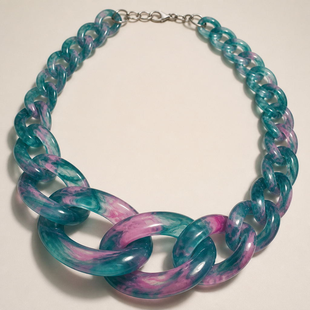 A women's necklace. create a chunky Cuban Link style plastic chain that is o graduated and exaggerated in the first front three links that is translucent a base color of teal with some pink swirls throughout it
photorealistic jewelry design, A women's necklace. create a chunky Cuban Link style plastic chain that is o graduated and exaggerated in the first front three links that is translucent a base color of teal with some pink swirls throughout it, modern style, just the design no text