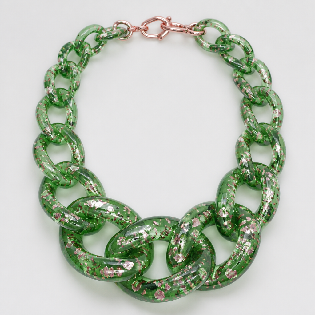 A women's necklace. Please make me a jewelry image of a chunky graduated necklace chain in translucent green plastic with pink metallic confetti inside
photorealistic jewelry design, A women's necklace. Please make me a jewelry image of a chunky graduated necklace chain in translucent green plastic with pink metallic confetti inside, modern style, just the design no text