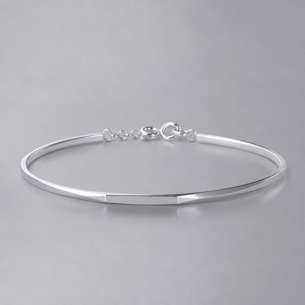 A women's bracelet made of silver, minimalist, simple and delicate, clean lines. a 1mm*4mm bracelet
photorealistic jewelry design, A women's bracelet made of silver, minimalist, simple and delicate, clean lines. a 1mm*4mm bracelet, modern style, just the design no text