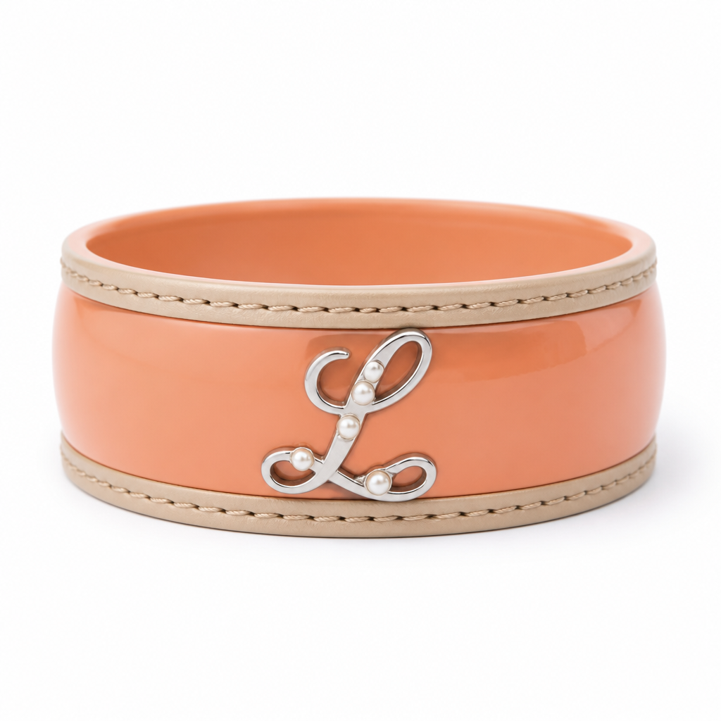 Create a premium streetwear bracelet with a bold, modern aesthetic. The bracelet should be thick and slightly oversized, made primarily of smooth, durable plastic in a soft peach-orange color. Along both outer edges, add beige leather trim with clean stitching to create a high-end contrast. In the center of the bracelet, place an elegant cursive letter “L” crafted from polished silver. Decorate the letter with a few small, subtle white pearls, keeping the design minimal and sophisticated rather than flashy. The overall style should feel luxurious, trendy, and fashion-forward, inspired by contemporary streetwear brands. Render it as a realistic high-end product photo with soft studio lighting, ultra-detailed textures, a clean white background, and a premium jewelry photography aesthetic.
photorealistic jewelry design, Create a premium streetwear bracelet with a bold, modern aesthetic. The bracelet should be thick and slightly oversized, made primarily of smooth, durable plastic in a soft peach-orange color. Along both outer edges, add beige leather trim with clean stitching to create a high-end contrast. In the center of the bracelet, place an elegant cursive letter “L” crafted from polished silver. Decorate the letter with a few small, subtle white pearls, keeping the design minimal and sophisticated rather than flashy. The overall style should feel luxurious, trendy, and fashion-forward, inspired by contemporary streetwear brands. Render it as a realistic high-end product photo with soft studio lighting, ultra-detailed textures, a clean white background, and a premium jewelry photography aesthetic., classic style, just the design no text