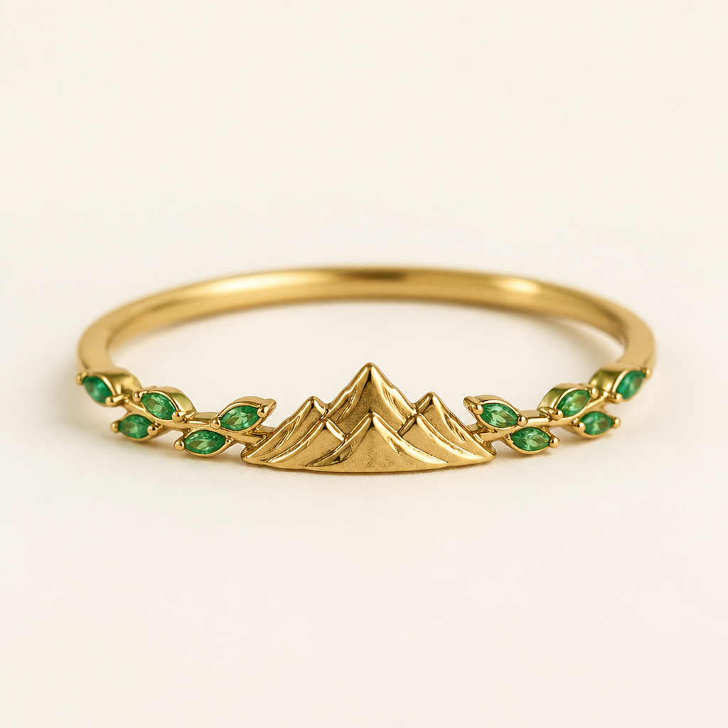 A minimalist women's ring made of gold with emerald stones suitable for anniversary. un collar con gemas pequeñas tipo hojas y al final en frente una montaña
photorealistic jewelry design, A minimalist women's ring made of gold with emerald stones suitable for anniversary. un collar con gemas pequeñas tipo hojas y al final en frente una montaña, minimalist style, just the design no text