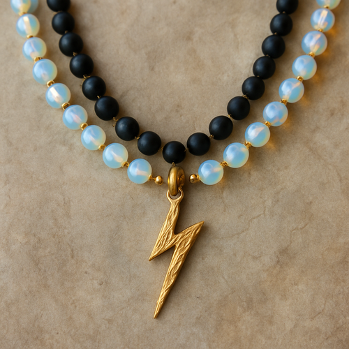 Opalite and onyx necklace with a gold lightening strike pendent