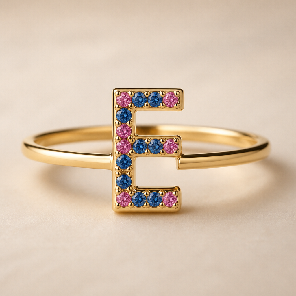 A modern women's ring made of gold suitable for birthday, minimalist, simple and delicate, clean lines. um anel de 15 anos com inicial E com pedrinhas azul e pedrinhas rosa em volta
photorealistic jewelry design, A modern women's ring made of gold suitable for birthday, minimalist, simple and delicate, clean lines. um anel de 15 anos com inicial E com pedrinhas azul e pedrinhas rosa em volta, modern style, just the design no text
