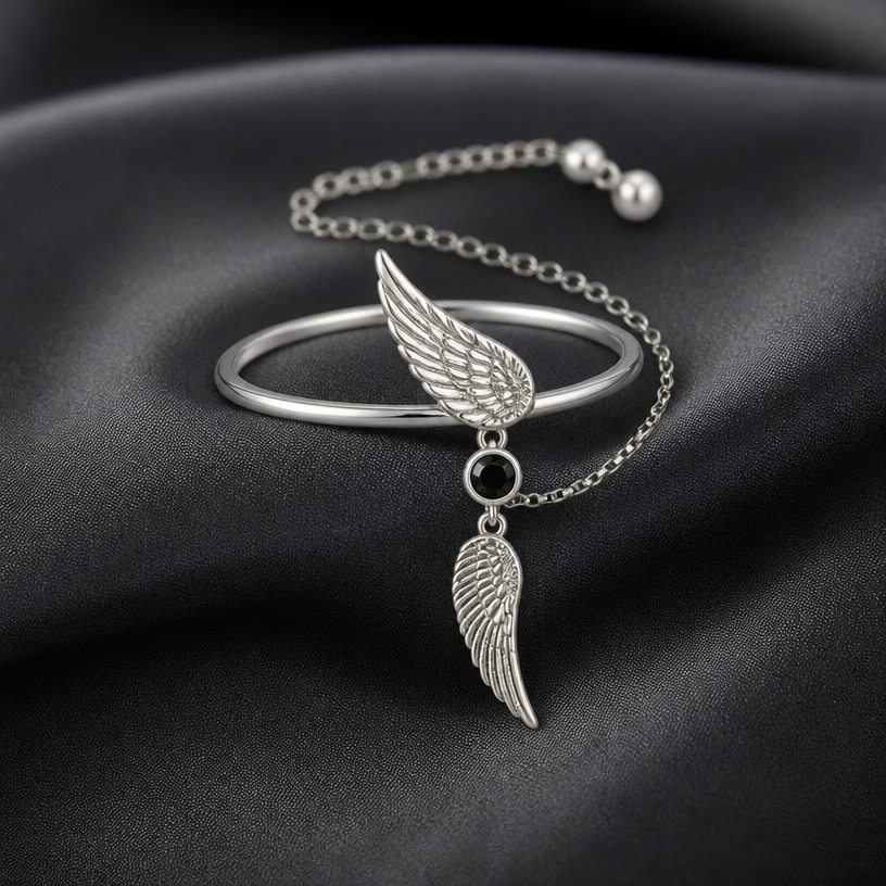 A women's ring. feather pendant join by round black gemstone with adjustable chain
using the attached image as a visual reference, create A women's ring. feather pendant join by round black gemstone with adjustable chain. photorealistic, just the design no text