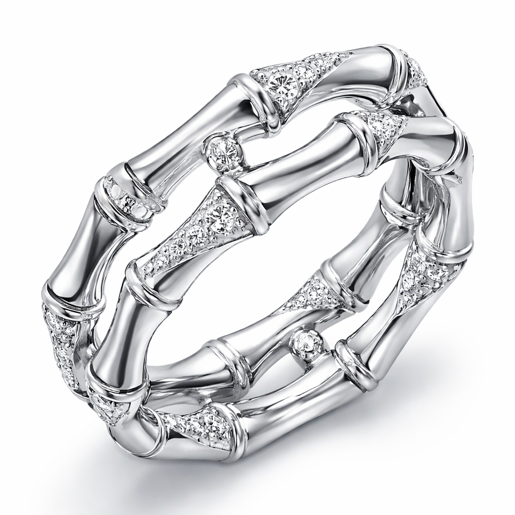 The Bamboo ring translates the lightness and resilience associated with bamboo into a continuous, sculptural design. Crafted in 18k white gold, diamonds are placed with intention throughout the piece, enhancing its graphic character and refined sense of precision.