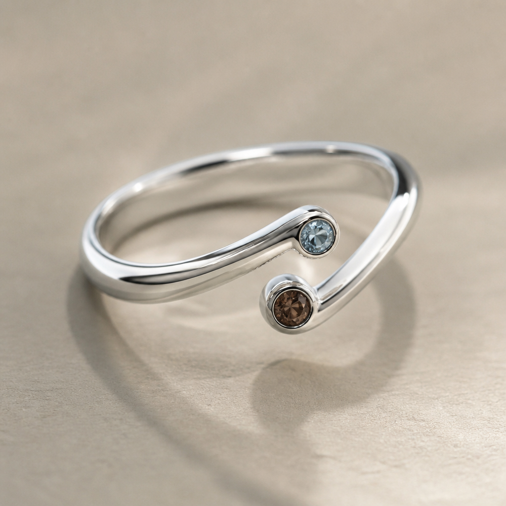 A women's ring made of white gold. изящное немного элегнтное кольцо из белого золото в немного необычной форме но есть место для внутреней гравировки и с двумя не большими драгоценными камнями, один голубого цвета а второй коричневого
photorealistic jewelry design, A women's ring made of white gold. изящное немного элегнтное кольцо из белого золото в немного необычной форме но есть место для внутреней гравировки и с двумя не большими драгоценными камнями, один голубого цвета а второй коричневого, modern style, just the design no text