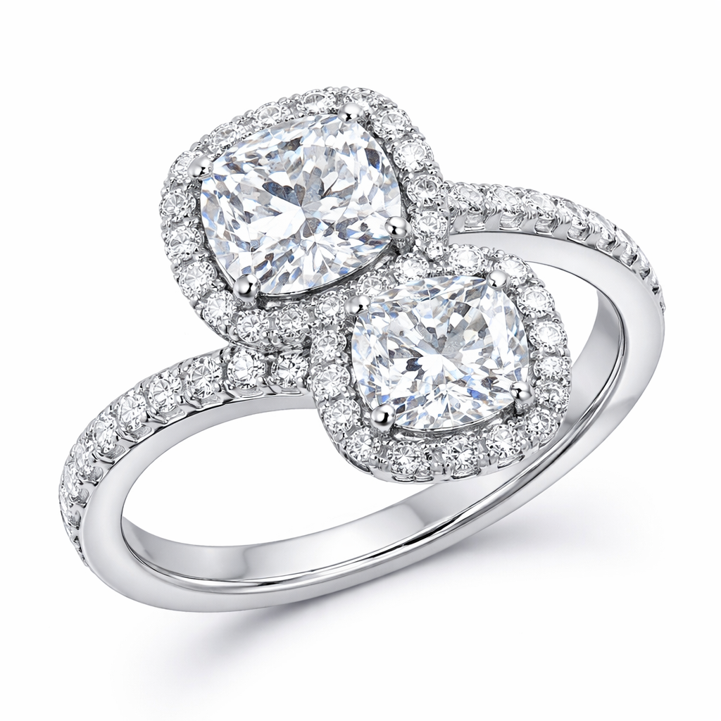 Ring with 2 cushion cut diamonds each one has a halo surround, one is a little smaller than the other