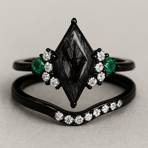 Skinny Kite cut Black rutilated quartz with 1 emerald on each side and 3 moissanite on each side accent stones in a cluster on a black band, separate wedding band black with moissanite stones that curves around the main stone 