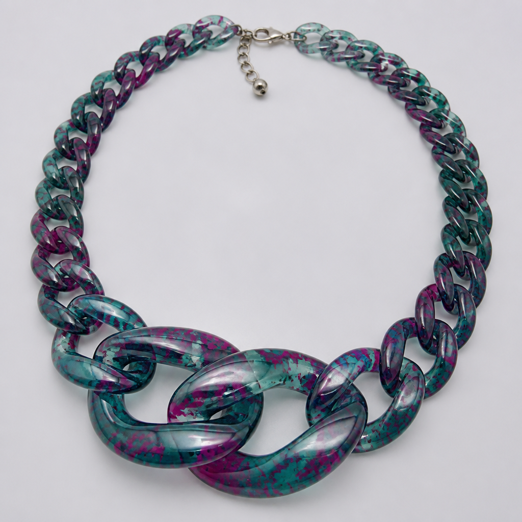 A women's necklace. create a chunky Cuban Link style plastic chain that is o graduated and exaggerated in the first front three links that is translucent a base color of teal and speckled with fuchsia throughout it
photorealistic jewelry design, A women's necklace. create a chunky Cuban Link style plastic chain that is o graduated and exaggerated in the first front three links that is translucent a base color of teal and speckled with fuchsia throughout it, modern style, just the design no text