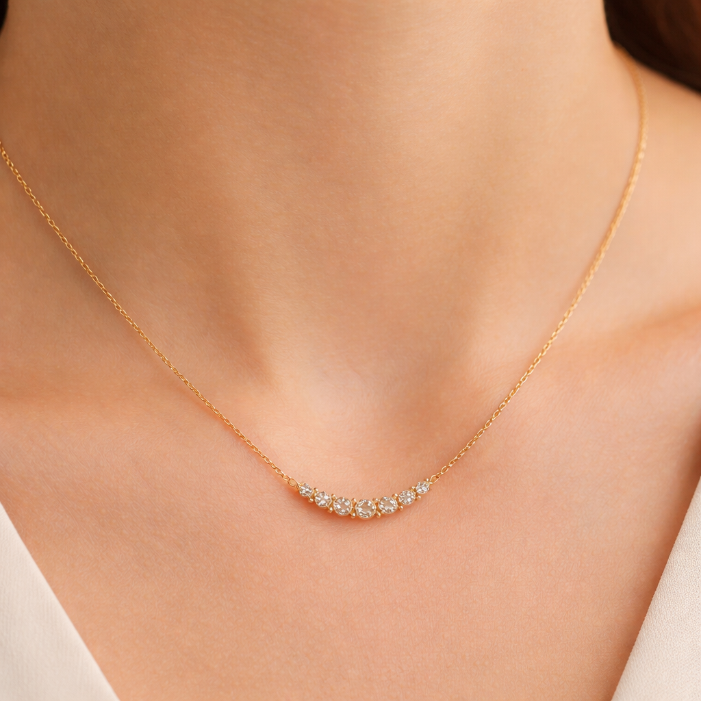 A minimalist women's necklace made of gold with diamond stones suitable for daily wear
A minimalist women's necklace made of gold with diamond stones suitable for daily wear, minimalist style