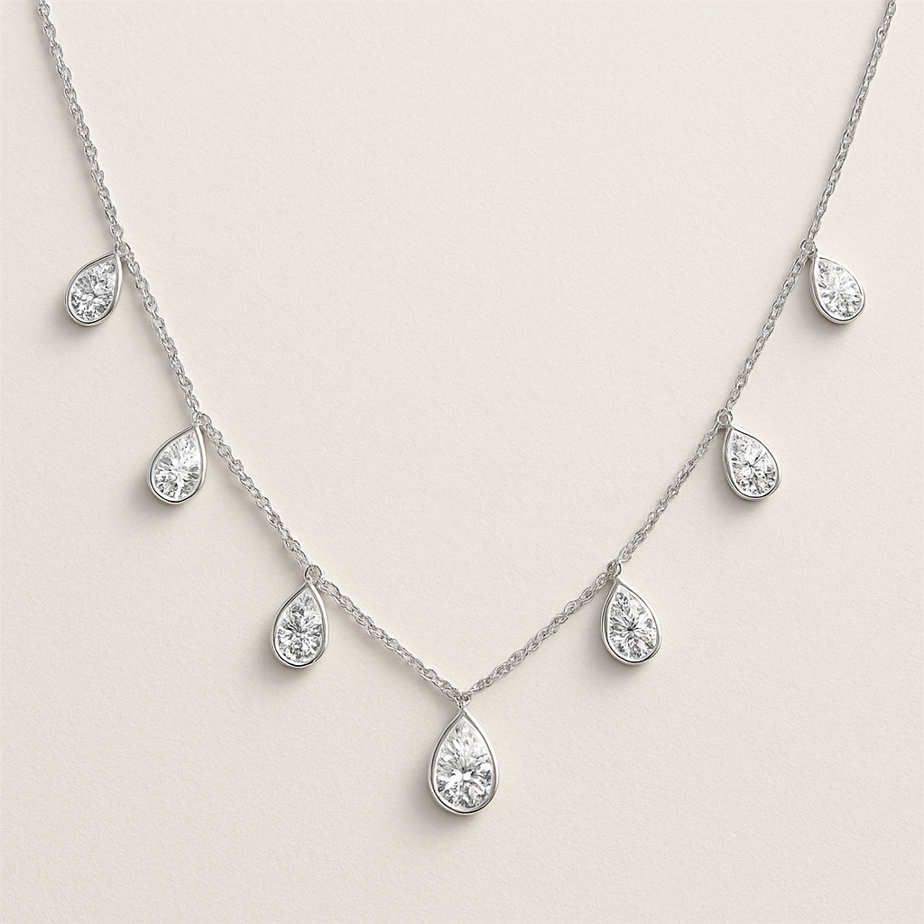 Pear shape pears station necklace 7 diamonds each diamonds .15 