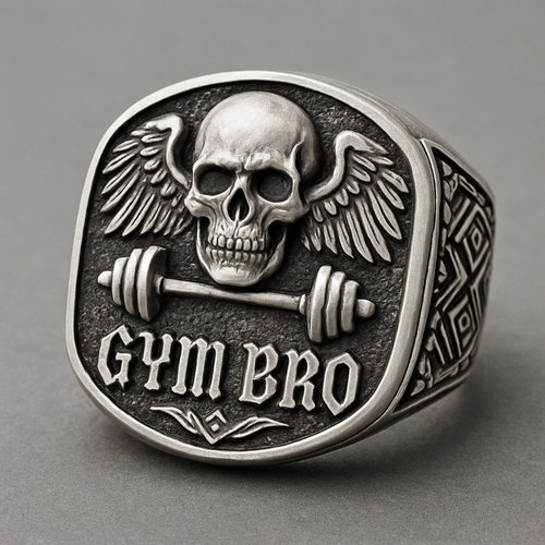 Silver signet ring with angle wings on a   skull with barbell with gym bro stamped at the bottom in fancy letters 