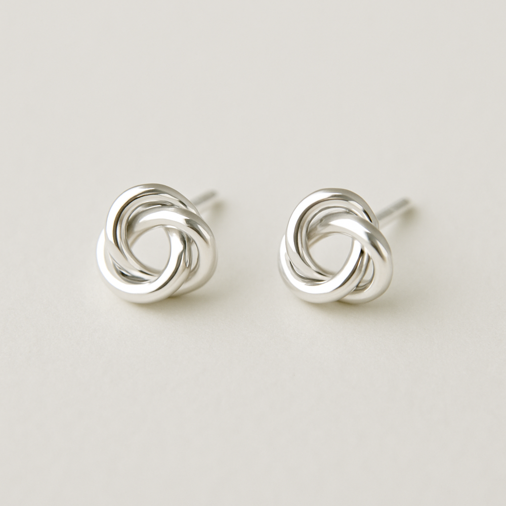 "Love's Knot" Stud Earrings: Elegant sterling silver stud earrings in the shape of a perfectly formed, simple love knot. No stones, just the beautiful, symbolic intertwining of silver.