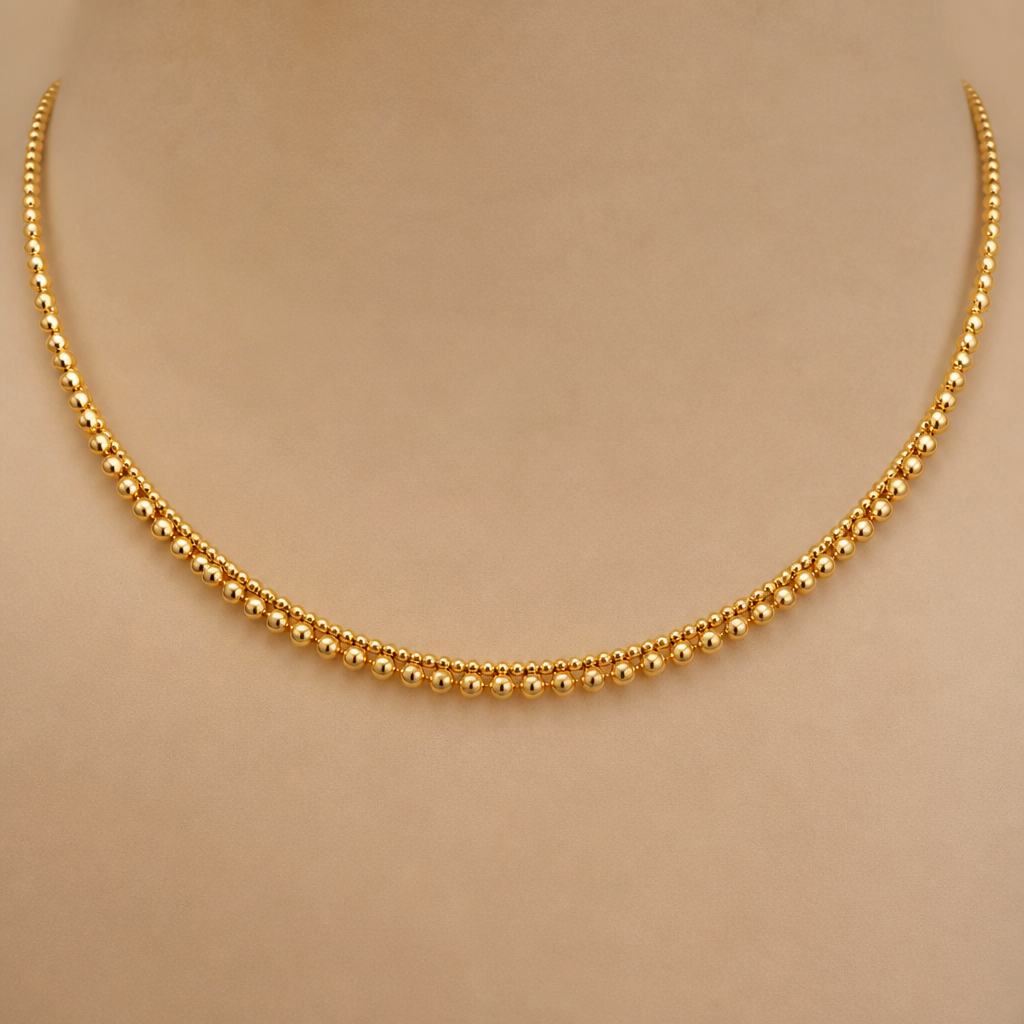 A women's necklace made of gold. 1mm golden beads and 0mm golden beads single thushi design