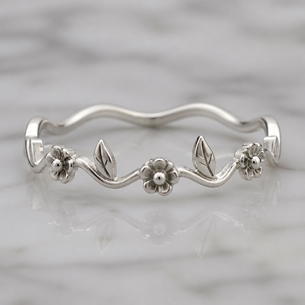 A women's ring. Creame un anillo ondulado pero no tan ondulado con tres flor era de 5 petalos algo pequeños con una bolita adentro las flores estaba separados tenia un patron de flor una hoja apuntando para ariba y despues una hoja apuntando para abajo despues una flor asi sucesivamente pero las hojas eran algo puntiagudas pero no tanto y tenia como una cortada en medio simulando la vena todo era de plata
photorealistic jewelry design, A women's ring. Creame un anillo ondulado pero no tan ondulado con tres flor era de 5 petalos algo pequeños con una bolita adentro las flores estaba separados tenia un patron de flor una hoja apuntando para ariba y despues una hoja apuntando para abajo despues una flor asi sucesivamente pero las hojas eran algo puntiagudas pero no tanto y tenia como una cortada en medio simulando la vena todo era de plata, modern style, just the design no text