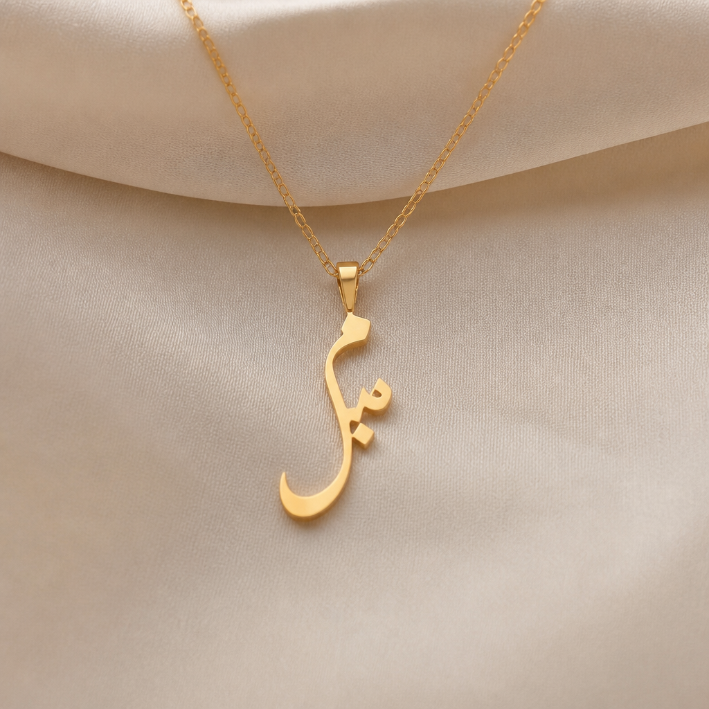 A minimalist women's pendant made of gold suitable for formal. should be thin flat initial of meem (urdu) initial
photorealistic jewelry design, A minimalist women's pendant made of gold suitable for formal. should be thin flat initial of meem (urdu) initial, minimalist style, just the design no text
