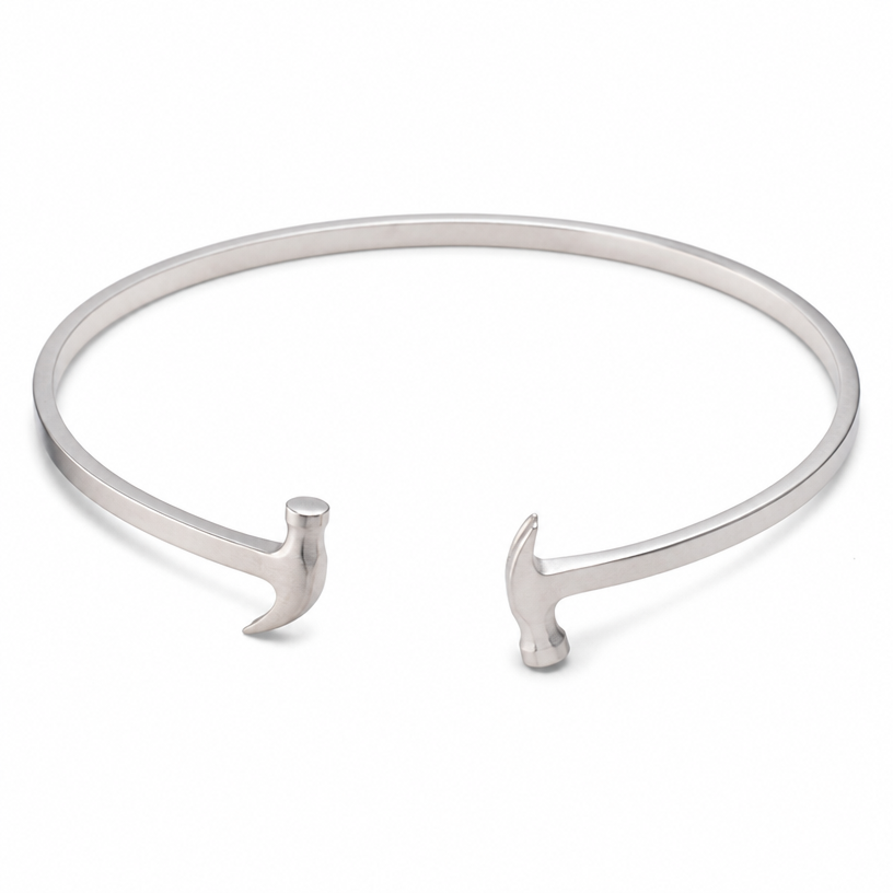 A women's bracelet made of silver, minimalist, simple and delicate, clean lines. a 3mm square bracelet both ends looks exactly like this hammer in the reference photo one looking up and the other end looking down but the same shape and size just looking in the opposite directions
using the attached image as a visual reference, create A women's bracelet made of silver, minimalist, simple and delicate, clean lines. a 3mm square bracelet both ends looks exactly like this hammer in the reference photo one looking up and the other end looking down but the same shape and size just looking in the opposite directions. photorealistic, just the design no text