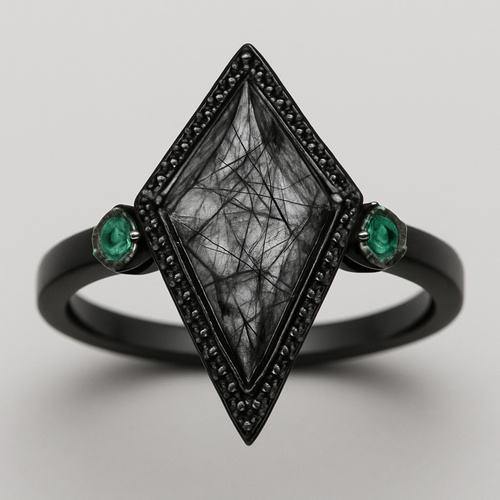 Black band, kite cut tourmalated quartz, emerald accent stones, second band black going around the kite stone with black stones