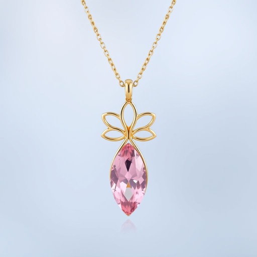 A everyday wear but delicate small gold necklace with a pink pendant color gemstone in a marquise cut. All the details are delicate and they rappresent the petals of the flower lotus.