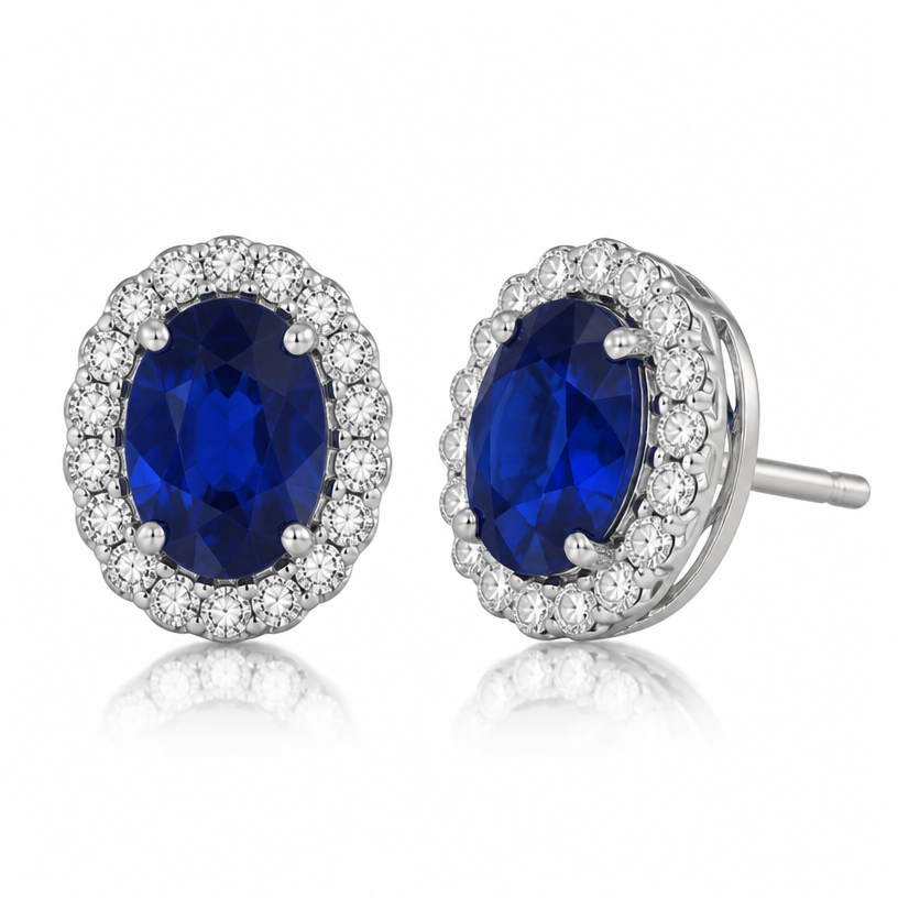 A women's earrings made of white gold with sapphire stones. 9k white gold halo earring.7mm x 5mm oval sapphire in the center
44 of 1.4mm diamonds used in the halo.
using the attached image as a visual reference, create A women's earrings made of white gold with sapphire stones. 9k white gold halo earring.7mm x 5mm oval sapphire in the center
44 of 1.4mm diamonds used in the halo.. photorealistic, just the design no text