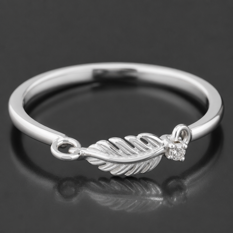 A women's ring made of silver suitable for daily wear. single rhinestone feather pendant chain small
using the attached image as a visual reference, create A women's ring made of silver suitable for daily wear. single rhinestone feather pendant chain small. photorealistic, just the design no text