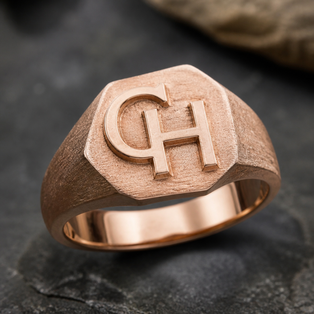 A women's ring made of gold. anillo rustico con letra inicial CH en oro rosa para hombre
