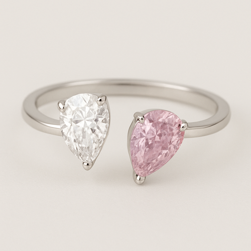 Design a toi ET moi with two pear shaped diamonds. Make them 1ct big and one of them pink diamons