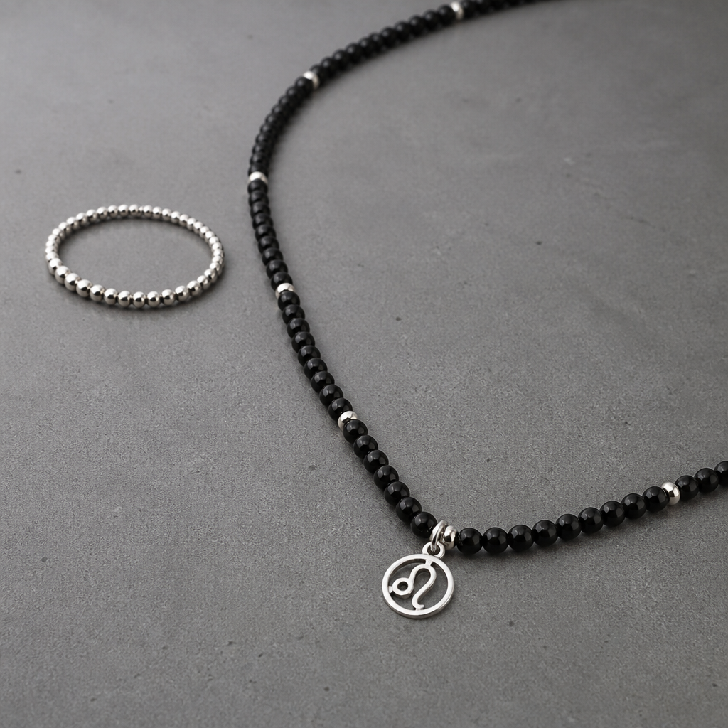 A beaded men's ring made of silver, ultra-minimalist, very simple and clean, understated, no embellishments. Create a men's necklace approximately 50-60 cm long with occasional metal accents (spacers) and black onyx. The necklace should feature a charm with the Leo zodiac sign as an initial, without a background and not too large. just a simple charm without background or any details in a simple circle.
photorealistic jewelry design, A beaded men's ring made of silver, ultra-minimalist, very simple and clean, understated, no embellishments. Create a men's necklace approximately 50-60 cm long with occasional metal accents (spacers) and black onyx. The necklace should feature a charm with the Leo zodiac sign as an initial, without a background and not too large. just a simple charm without background or any details in a simple circle., beaded style, just the design no text