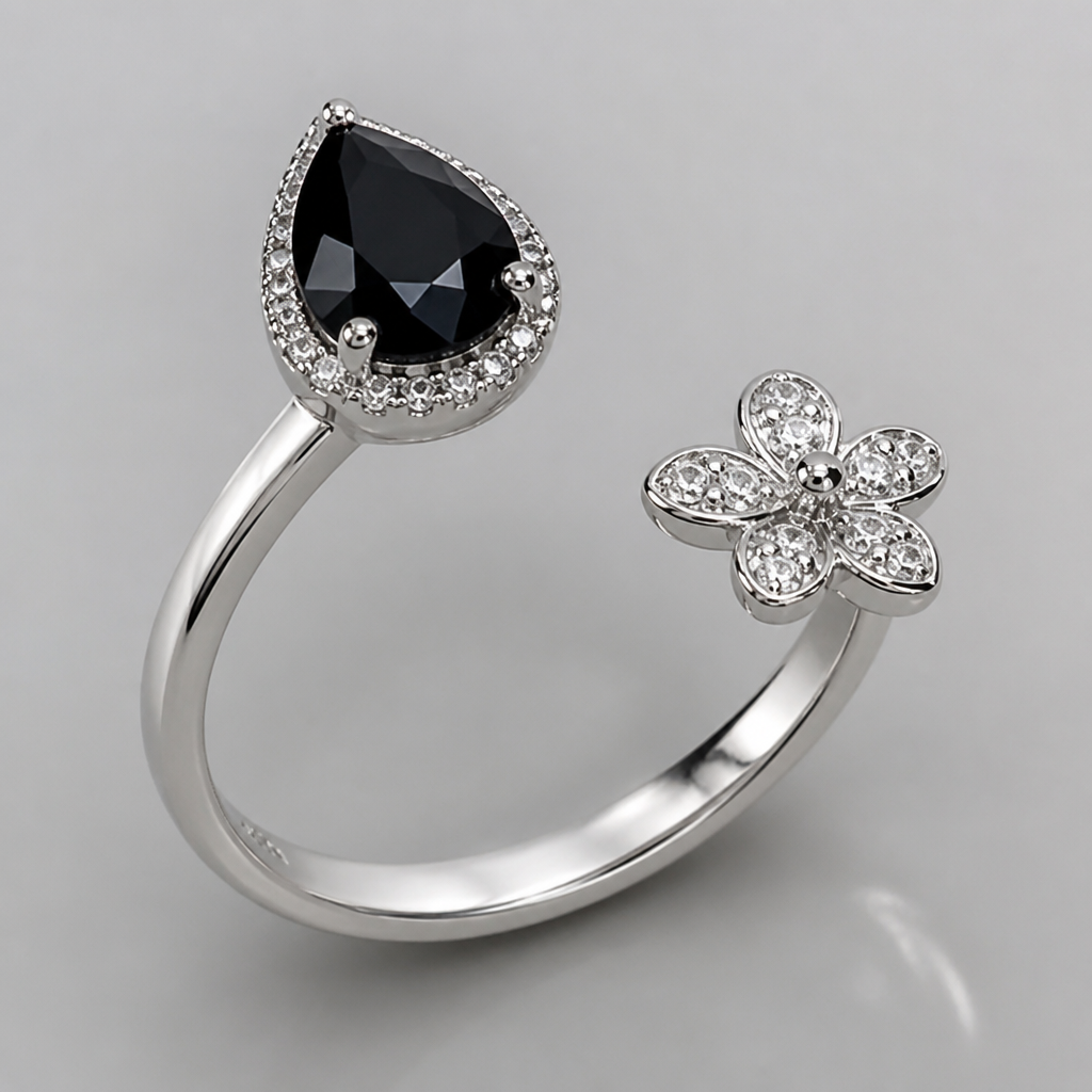 A modern women's ring made of silver with diamond stones. A black stone at one end and A small silver flower at another end of the ring should contain some gap between them
photorealistic jewelry design, A modern women's ring made of silver with diamond stones. A black stone at one end and A small silver flower at another end of the ring should contain some gap between them, modern style, just the design no text