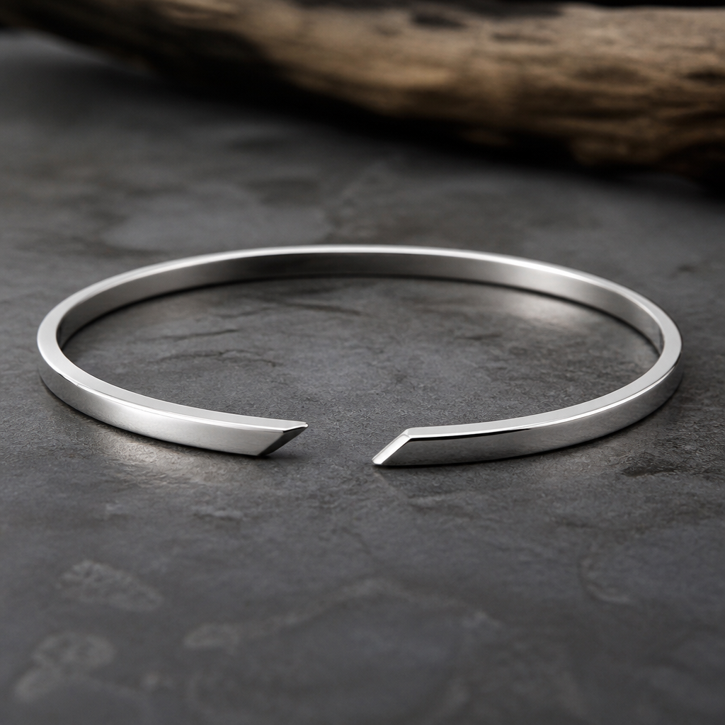 A men's bracelet made of silver. 2mm*4.5mm cuff with the gap in the front and the gap is italic
photorealistic jewelry design, A men's bracelet made of silver. 2mm*4.5mm cuff with the gap in the front and the gap is italic, modern style, just the design no text