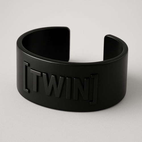 Thick black bracelet that says “TWIN” inside brackets