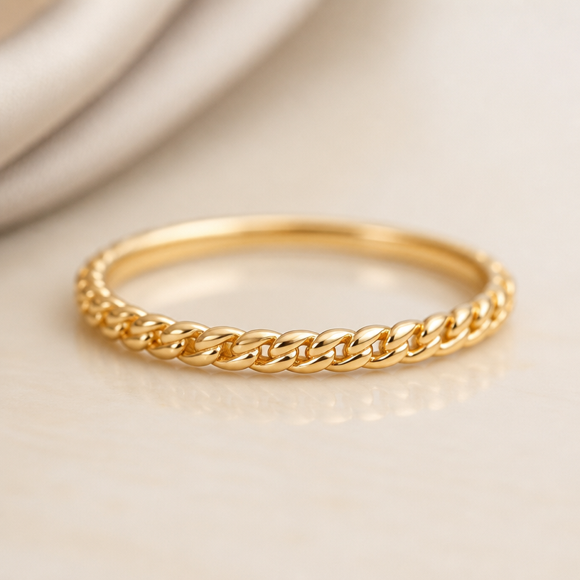 A luxury women's ring made of gold, minimalist, simple and delicate, clean lines. dainter version of these chains
using the attached image as a visual reference, create A luxury women's ring made of gold, minimalist, simple and delicate, clean lines. dainter version of these chains. photorealistic, just the design no text